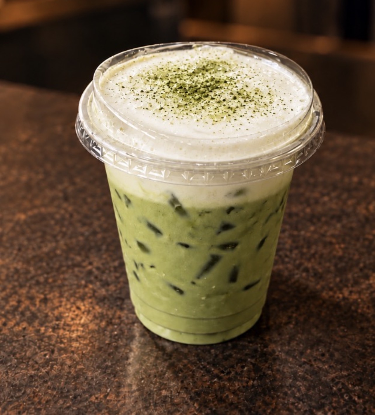 Iced matcha latte with foam